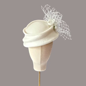 Bridal hat for wedding, civil ceremony formal hat, ivory felt with white ranunculus and veil trim, handmade sculpted felt headpiece