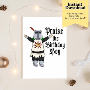 May include: A white greeting card featuring a cartoon knight with arms outstretched. The knight wears silver armor and a tunic with a sun emblem. The card reads "Praise the Birthday Boy" in gothic lettering. A yellow banner says "Instant Download".