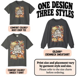 May include: A dark gray boxy crop tee, a dark gray unisex t-shirt, and a dark gray crewneck sweatshirt, each featuring a graphic print of Thanksgiving side dishes and the text THE SIDE CHICK. The image includes the text ONE DESIGN THREE STYLES.