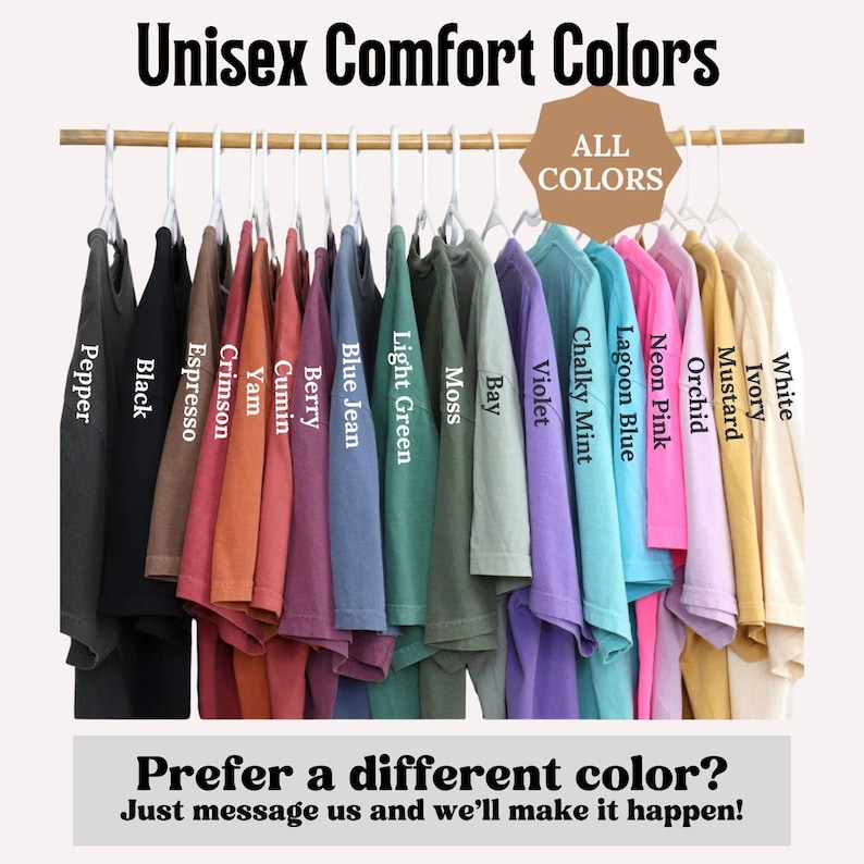 May include: A collection of short-sleeved t-shirts hanging on white plastic hangers, displayed in a spectrum of colors including Pepper, Black, Espresso, Crimson, Yam, Cumin, Berry, Blue Jean, Light Green, Moss, Bay, Violet, Chalky Mint, Lagoon Blue, Neon Pink, Orchid, Mustard, Ivory, and White.