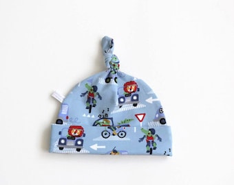 Cute blue cotton baby hat with cars, bicycles, lions, dogs and crocodiles. Baby knotted hat, knot hat, cotton baby hat, newborn. Baby boy
