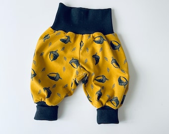 Baby pants. Yellow harem pants with acorns
