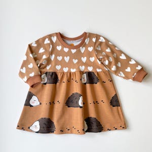 Girl&#39;s dress with hearts and hedgehogs. Skater dress. Jersey fabric dress. Toddler dress, skater dress