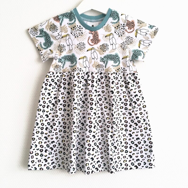 Girl's dress with leopards. Size 12 18 months White dress. White jersey fabric with leopards and leopard spots. Skater dress image 2