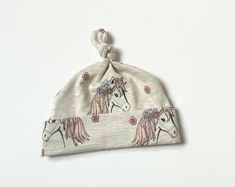 Beige baby knot hat with horses and flowers