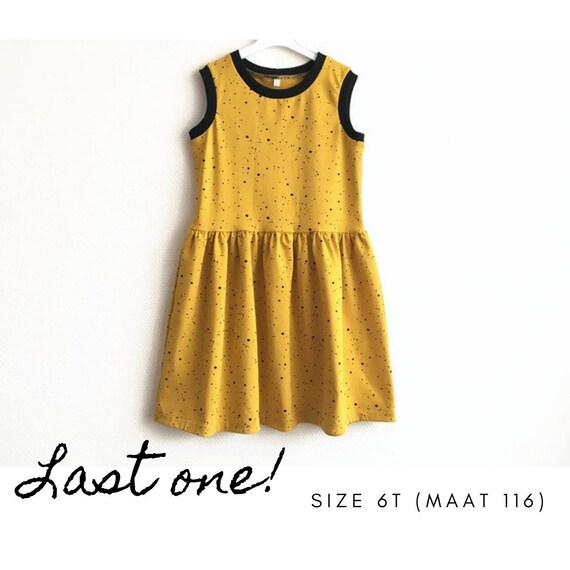 yellow dress with black spots