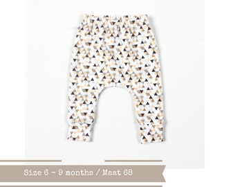 Last one: Baby infant harem pants with triangles. Size 6M. White cotton fabric. Peach, gold, grey sweat pants