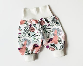 White baby pants with leaves and pink dots. Baggy harem pants