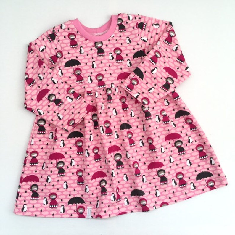 Last one: Girl's dress with girls, penguins and small clouds. Size 18 24 months. Pink dress. Pink jersey fabric. Skater dress image 2