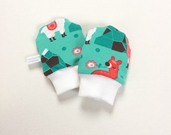 Baby scratch mitts. Mittens with cuffs. Shower gift. Green organic knit fabric with alpacas. Gender neutral no scratch mitts