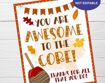 May include: A rectangular printable sign with a white background and a brown polka-dot border. The sign features the text "YOU ARE AWESOME TO THE CORE! THANKS FOR ALL THAT YOU DO!" with fall-themed graphics and a caramel apple illustration.
