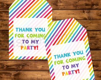 May include: Two colorful thank you tags with a rainbow striped background and white text that says "Thank you for coming to my party!"