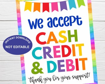 May include: A colorful sign with the text "we accept CASH CREDIT & DEBIT" and the words "thank you for your support!"  The sign has a rainbow background with a border of rainbow flags.