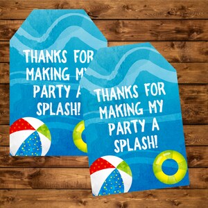 May include: Two blue and white thank you tags with a beach theme. The tags feature a beach ball, a life preserver, and the text "Thanks for making my party a splash!"