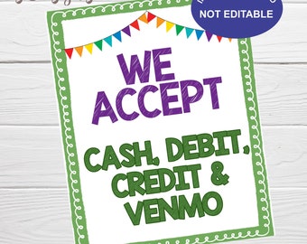 May include: A green and white sign with a festive banner of colorful flags at the top. The sign reads "WE ACCEPT CASH, DEBIT, CREDIT & VENMO" in purple and green text. The sign is 8x10 inches.