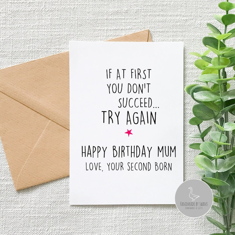 May include: A white card with black text that reads "If at first you don't succeed... try again."  A pink star is below the text.  The card also says "Happy Birthday Mum Love, Your Second Born."