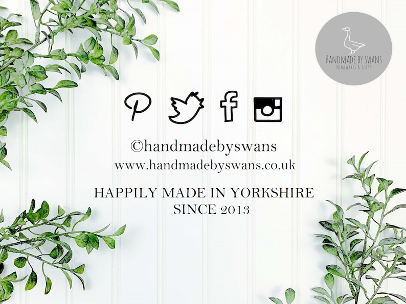 May include: A white background with green leafy branches on either side. The text "handmadebyswans" is centered on the image with the website address "www.handmadebyswans.co.uk" below it. The text "Happily Made in Yorkshire Since 2013" is centered below the website address. Social media icons for Pinterest, Twitter, Facebook, and Instagram are displayed above the text "handmadebyswans". A circular logo with a goose design and the text "HANDMADE BY SWANS HOMEWARES & GIFTS" is in the upper right corner of the image.
