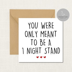 May include: White card with black text that reads "You were only meant to be a night stand" with three red hearts below the text.