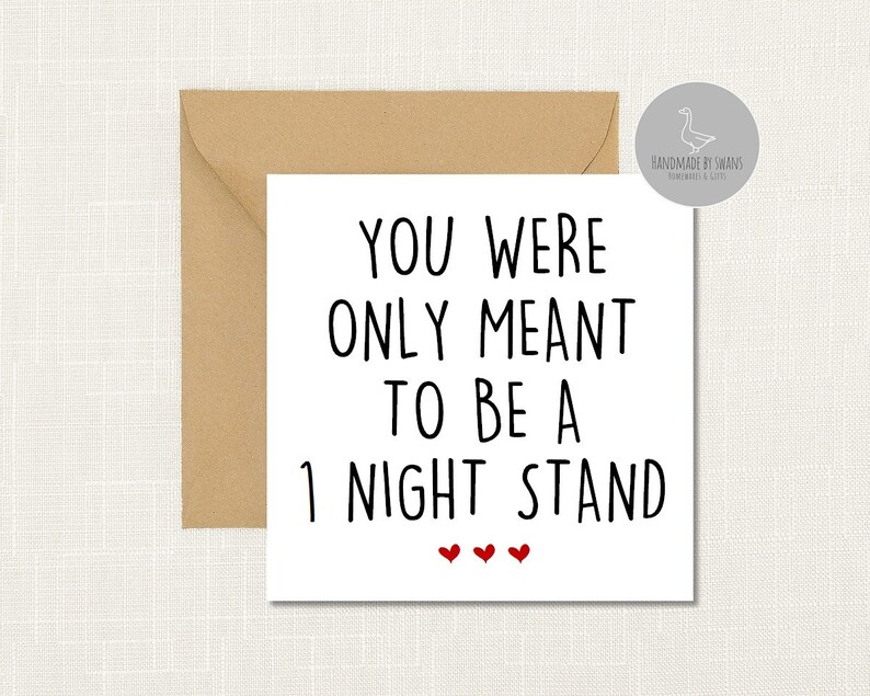 May include: White card with black text that reads "You were only meant to be a night stand" with three red hearts below the text.