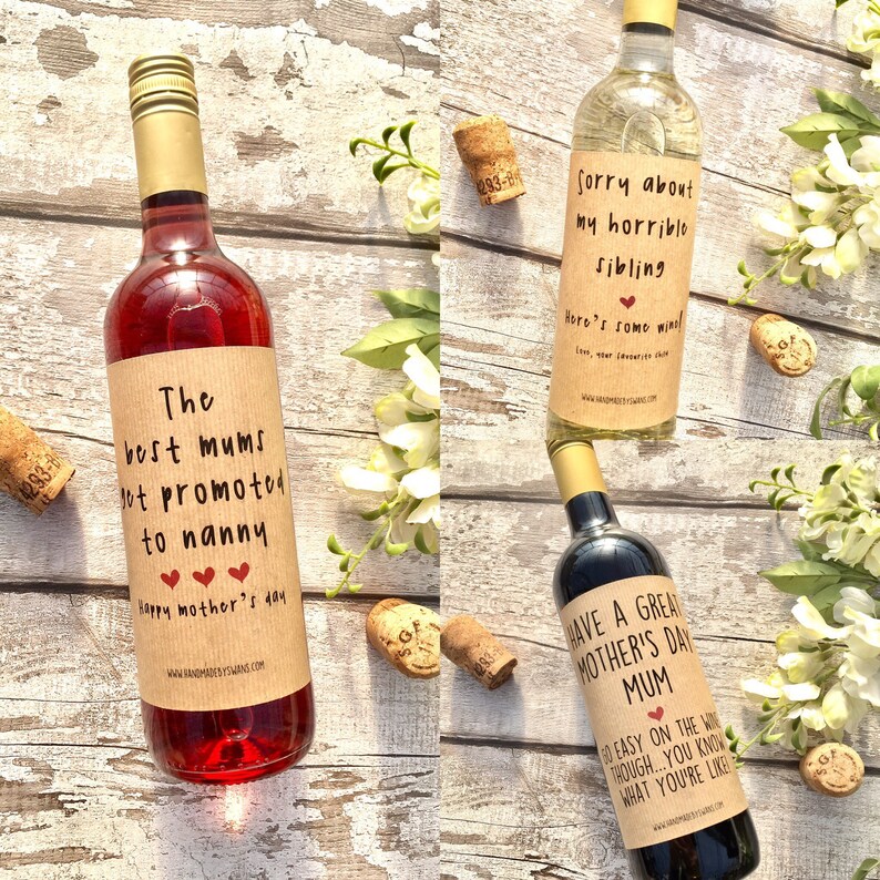 May include: Three wine bottles with humorous labels. The first bottle is a rose wine with a label that reads "The best mums get promoted to nanny". The second bottle is a white wine with a label that reads "Sorry about my horrible sibling. Here's some wine". The third bottle is a red wine with a label that reads "Have a great Mother's Day Mum. Go easy on the wine though... you know what you're like".