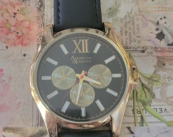 Reloj vintage American Exchange 5084 de cuarzo con esfera negra y dorada