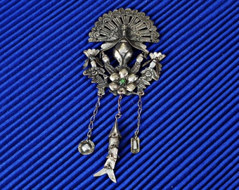 Silver pendant or brooch from Mexico handmade with peacock king and three symbols