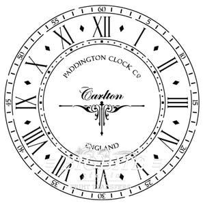 May include: Black and white clock face with Roman numerals and the text "Paddington Clock Co. Carlton England".