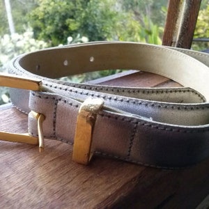 Silver leather belt with goldtone buckle made in Australia
