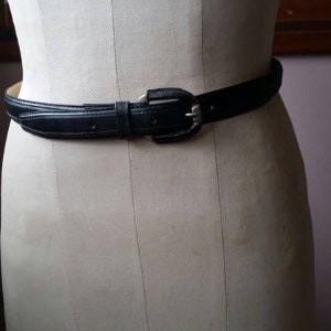 Navy blue leather belt with silvertone leather covered buckle