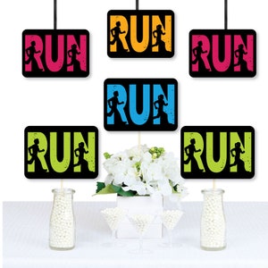 May include: Six table toppers with the word "RUN" in black with a silhouette of two runners in different colors. The colors are yellow, pink, blue, green, green, and pink.