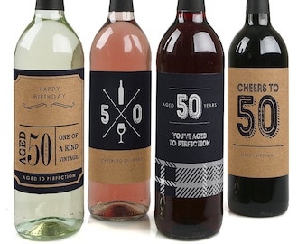 May include: Four wine bottles with labels celebrating a 50th birthday. The labels are brown with black text and graphics. The bottles are white, rose, red, and red.
