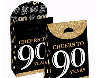 May include: Two black and gold gift bags with white polka dots. The bags have a gold glitter border and say "Cheers to 90 Years".