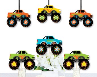 May include: Set of six monster truck cupcake toppers. The toppers feature different colored monster trucks with flames and wheels. The trucks are on sticks and can be used to decorate cupcakes or other desserts.
