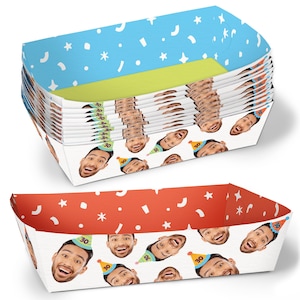 May include: A stack of rectangular party trays with a blue confetti pattern on the outside and a smiling face wearing a party hat on the inside. The trays are designed for a 30th birthday celebration.