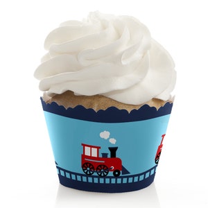 May include: Blue and white cupcake wrappers with a red train design. The wrappers feature a train with white smoke and a blue track.
