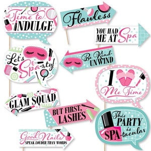May include: Set of 10 spa-themed photo booth props with sayings like "Time to Indulge", "Flawless", "You Had Me At Spa", "Let's Spa-rty", "Glam Squad", "But First, Lashes", "Be Kind-Unwind", "I  Me Time", "Good Nails Speak Louder Than Words", and "This Party is Spa-tacular".