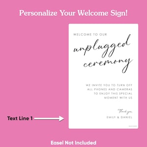 May include: A white sign with black text on a pink background. The sign reads "Welcome to our unplugged ceremony." It also includes a request to turn off phones and cameras. The sign is personalized with the names "Emily & Daniel."