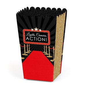 May include: Black and gold popcorn box with a red and gold red carpet design. The box has the text "Lights, Camera, ACTION!" on the front.