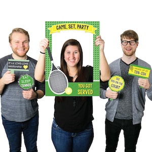 May include: A set of three photo booth props for a tennis-themed party. The props include a large frame with the text "GAME, SET, PARTY" and a tennis racket, a smaller sign with the text "YOU GOT SERVED", and a sign with the text "SEE YOU ON THE COURT".