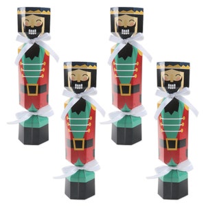 May include: Four red, green, and black nutcracker-themed Christmas cracker favors. Each cracker has a white ribbon tied around it.