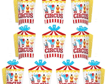 May include: Set of ten colorful circus-themed party favor boxes with a red, yellow, and blue striped design. Each box features a cartoon image of an elephant, a seal, and a lion with the word "CIRCUS" printed on the front.