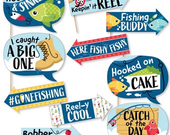 May include: A set of 10 colorful fishing-themed photo booth props. The props feature phrases like "Hook, line & sinker", "Keepin' it reel", "Fishing buddy", "I caught a big one", "Here fishy fishy", "#Gonefishing", "Reel-y cool", "Hooked on cake", and "Catch of the day".