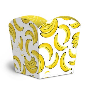 May include: A square-shaped paper container featuring a repeating pattern of bright yellow bananas on a white background. The design includes both individual bananas and small clusters, with some outlines in a light gray color.
