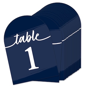 May include: A set of 20 navy blue table number cards with white brushstrokes and the text "table" and a white number. The number in the image is 1.