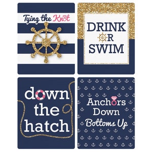 May include: Four blue and white nautical themed printable signs with gold glitter accents. The signs say "Tying the Knot", "Drink or Swim", "Down the Hatch", and "Anchors Down Bottoms Up".