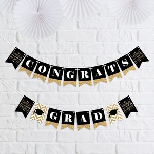 May include: Black and gold graduation banner with the text "Congrats" and "Grad" and the phrase "The tassel is worth the hassle".