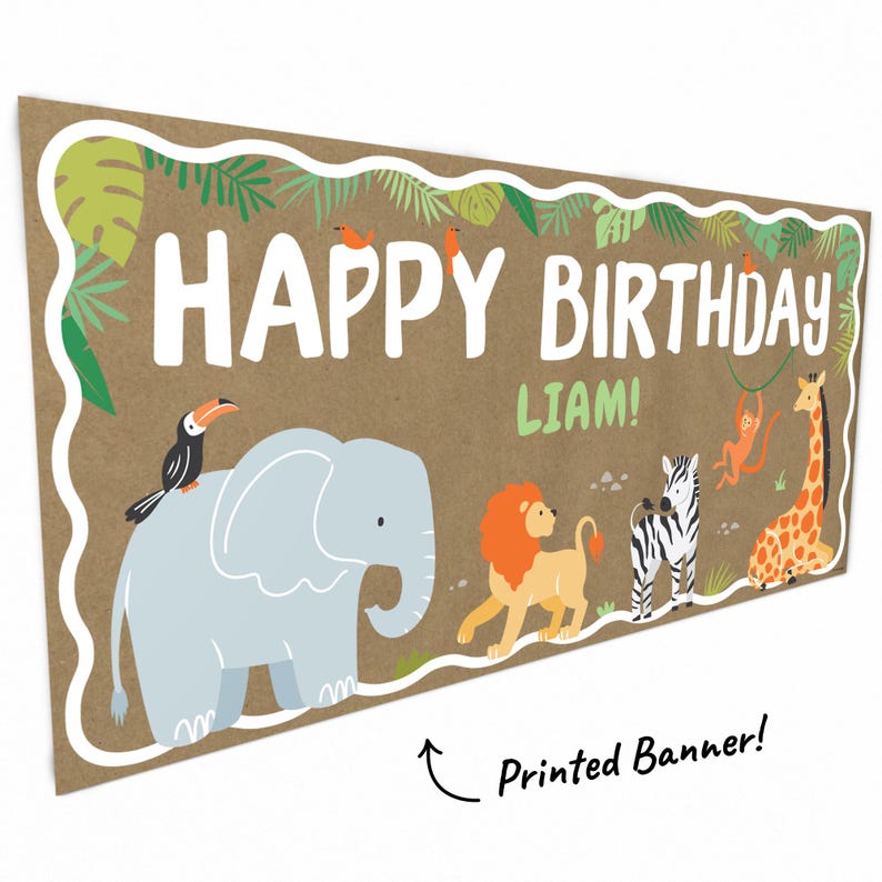 May include: A rectangular banner with a brown background and white border. The banner reads "HAPPY BIRTHDAY LIAM!" in large white letters. Cartoon animals, including an elephant, lion, zebra, and giraffe, are featured. A toucan and monkey are also present. The banner is a printed product.