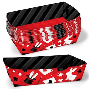 May include: A stack of red and black paper party favor boxes with a magic theme. The boxes feature a white rabbit, a top hat, a magic wand, and playing cards.