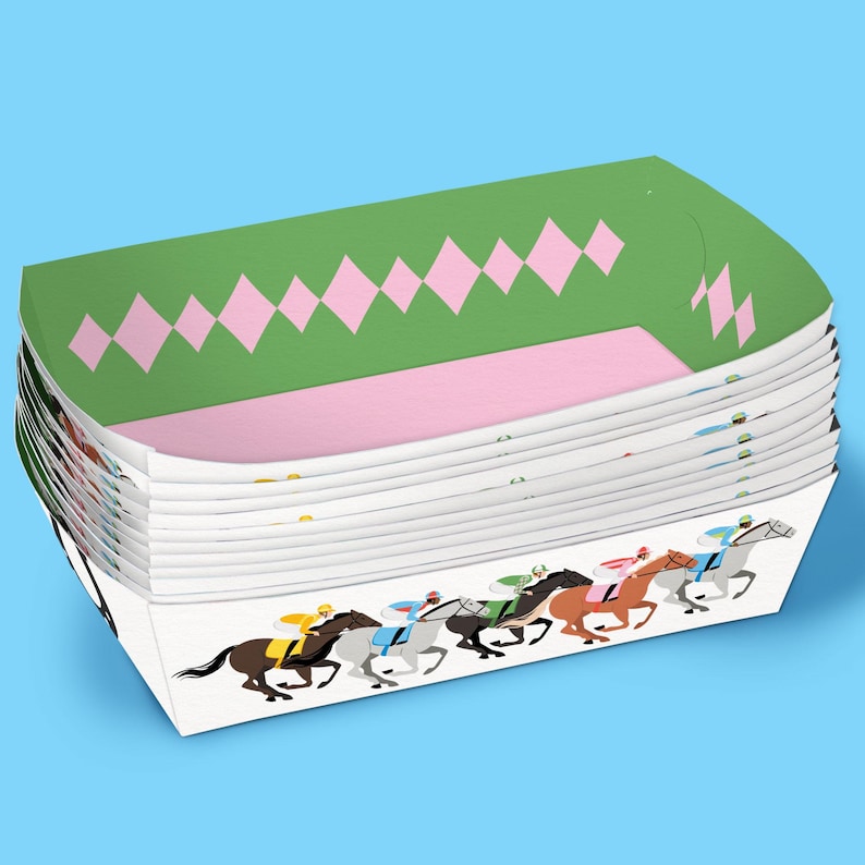 May include: A stack of white paper food trays. The top edge has a green and pink diamond pattern. The bottom edge features a graphic of racehorses with jockeys in various colours, set against a light blue background.