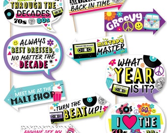 May include: A set of 10 colorful photo booth props with retro themes. The props feature phrases like "Partying Through the Decades", "Always Best Dressed", "Meet Me at the Malt Shop", "Turn the Beat Up", "Mixtape Master", "What Year is It?", "I Love the 70s 80s 90s", "Dancing Back in Time", "Groovy", and "Anyone See My Flip Phone?"